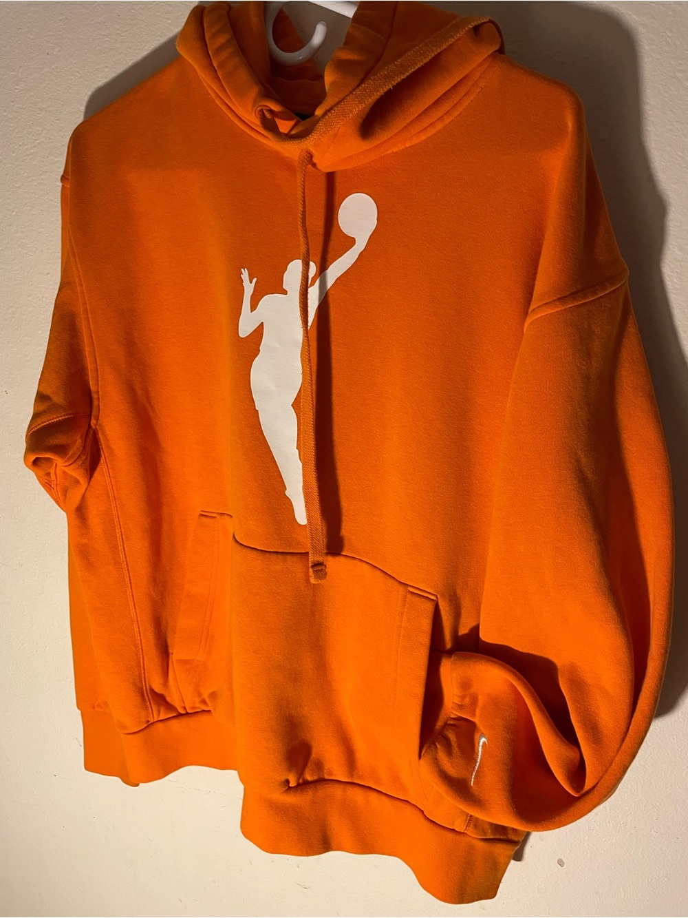 Women's Orange Graphic Pullover Hoodie with White Athlete Silhouette